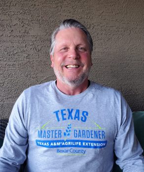 Portrait of Master Gardener Robert Butch Lee smiling in his Bexar County Master Gardener shirt